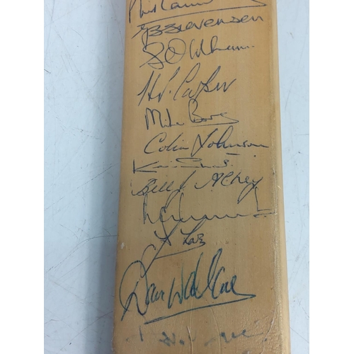 25 - MB utility golf club and a miniature cricket bat signed by the Yorkshire Cricket Team.  Geoffrey Boy... 