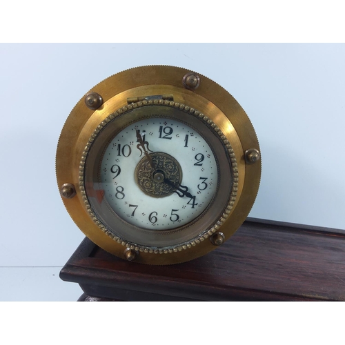 151 - Oriental brass clock on slopped stand