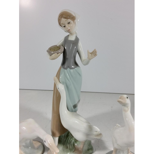 158 - Lladro lady with goose and 2 other geese
(Lady: 24cm tall)