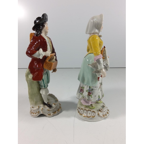 159 - German porcelain caricature figure of 2 men & pair of Porcelain figures
(Gent and Lady: 19.5cm tall)... 