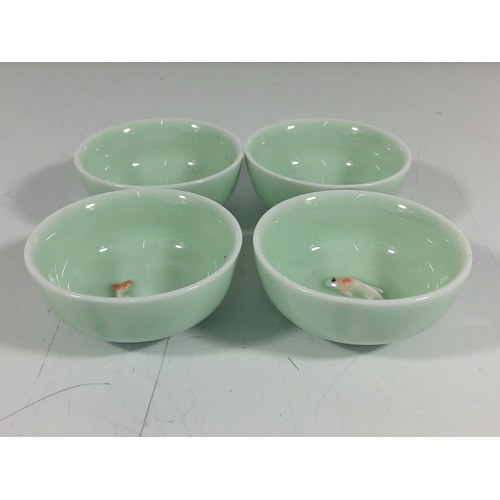 171 - 4 Porcelain dishes with swimming koy