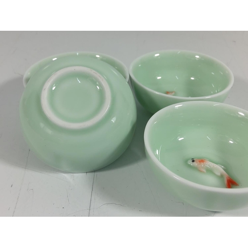 171 - 4 Porcelain dishes with swimming koy