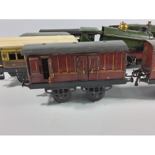 134 - 3 Vintage clockwork engines and 5 carriages / rolling stock