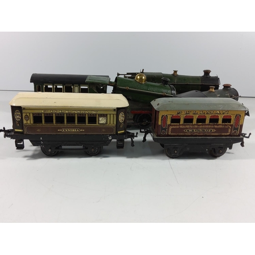 134 - 3 Vintage clockwork engines and 5 carriages / rolling stock