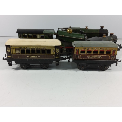 134 - 3 Vintage clockwork engines and 5 carriages / rolling stock