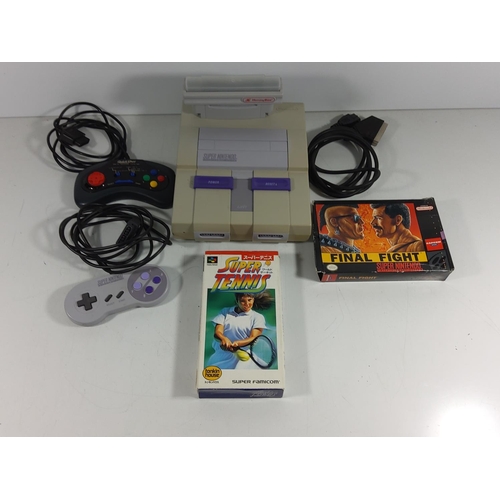 139 - Super Nintendo console with games and controllers