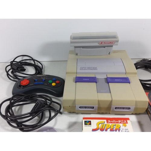 139 - Super Nintendo console with games and controllers