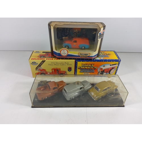 141 - Display case of 3 Holden cars and 3 other boxed model vehicles