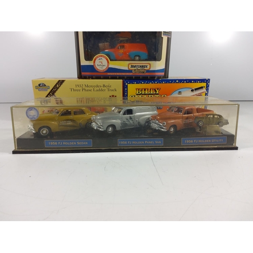 141 - Display case of 3 Holden cars and 3 other boxed model vehicles