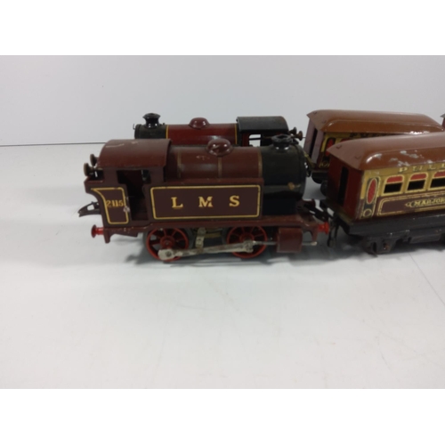 72 - 2 Clockwork engines and 4 carriages  - all hornby