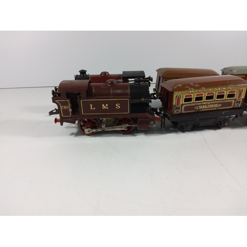 72 - 2 Clockwork engines and 4 carriages  - all hornby