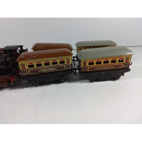 72 - 2 Clockwork engines and 4 carriages  - all hornby