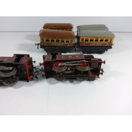 72 - 2 Clockwork engines and 4 carriages  - all hornby