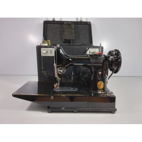 219 - Boxed Singer 222K sewing machine