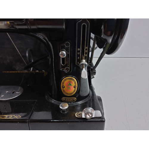 219 - Boxed Singer 222K sewing machine