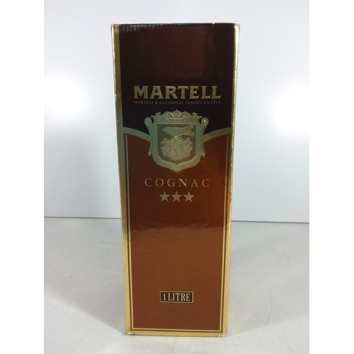 320 - Bottle of martell brandy