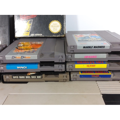 252 - Nintendo entertainment system complete with controllers and large selection of vintage cartridge gam... 