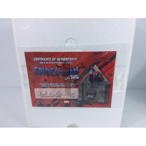 105 - 2 Spiderman clock tower wall statues