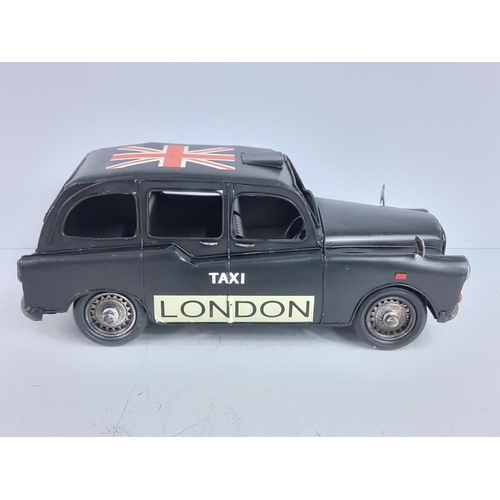 154 - Tin plate model of a London bus