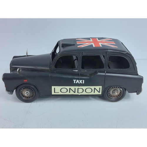 154 - Tin plate model of a London bus