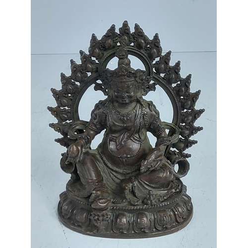 276 - Oriental cast bronze religious figure, 12cms in height