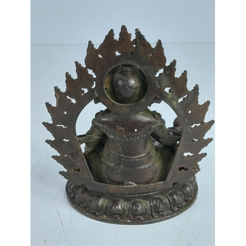 276 - Oriental cast bronze religious figure, 12cms in height