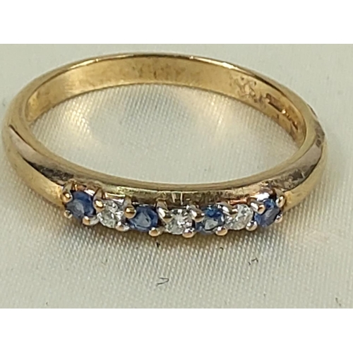 216 - 9ct gold tanzanite and diamond half hoop ring, size U