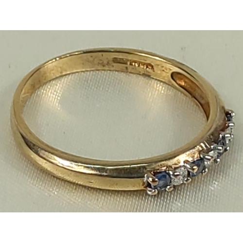 216 - 9ct gold tanzanite and diamond half hoop ring, size U