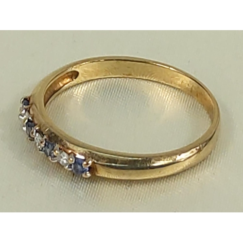 216 - 9ct gold tanzanite and diamond half hoop ring, size U