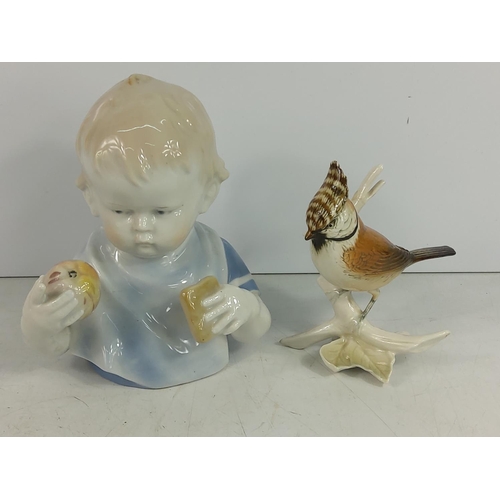 246 - Porcelain baby and porcelain bird