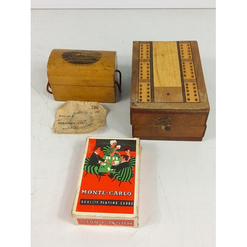 297 - Mauchlin ware box (with receipt) and a crib board