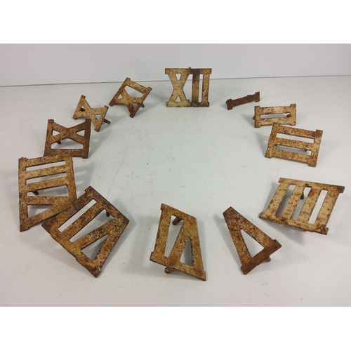 59 - Cast metal Roman numeral markers