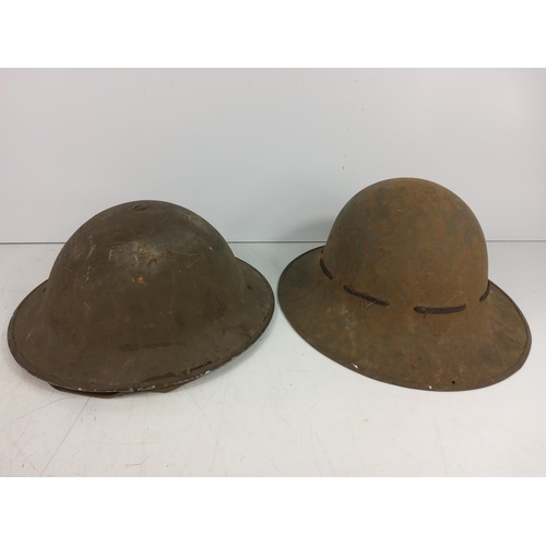 173 - 2 tin helmets