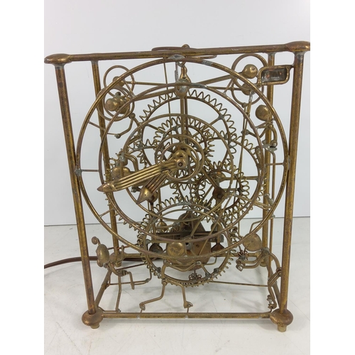 180 - Electric automaton style clock, 24 x 19 x 12cms