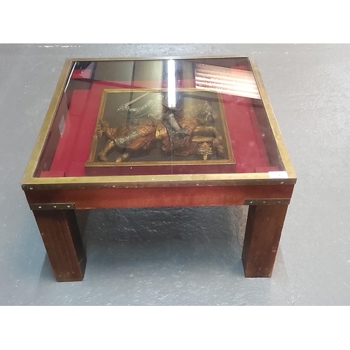 196 - Small brass bound table with Edward III on horseback inlaid, 59 x 59 x 37cms (one leg wobbles)