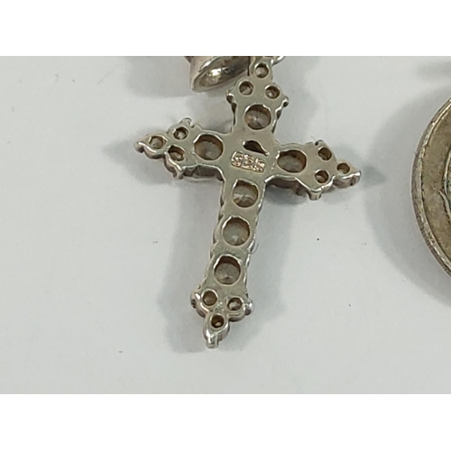 184 - 9ct gold cross and St Christopher (2.9g), silver buckle ring (5.9g), coin and cross and one other cr... 