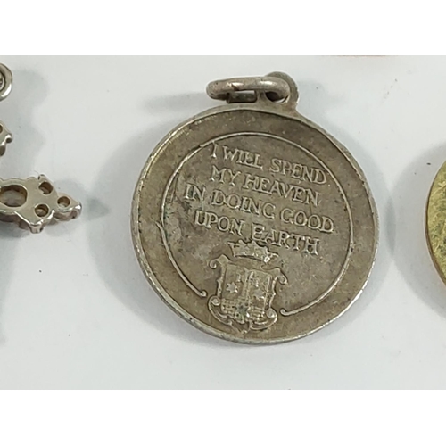 184 - 9ct gold cross and St Christopher (2.9g), silver buckle ring (5.9g), coin and cross and one other cr... 