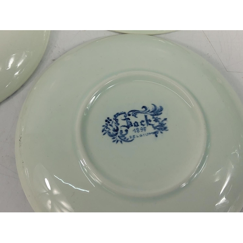 66 - Large white porcelain entre dish, 37cms in diameter and 5 blue and white plates, 11cms in diameter