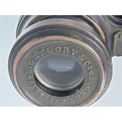 81 - Pair of antique field binoculars by W. Gregory of 51 The Strand with military markings