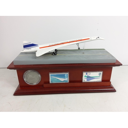 86 - Collectable Concord model on plinth with collectors coin and stamps