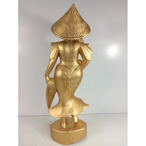 88 - Carved wooden oriental lady, 62cms in height