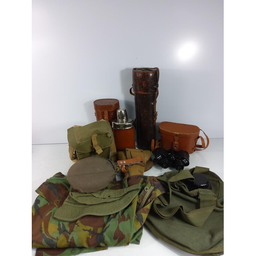 124 - Various leather bound bottles and cases, holster and binoculars, trousers etc including military