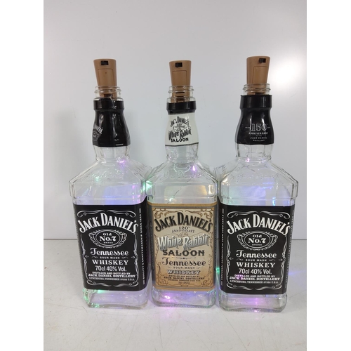 26 - Pair of boots and 3 Jack Daniels bottles with lights