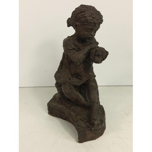 634 - Cold cast figure of a girl and dog, 18cms