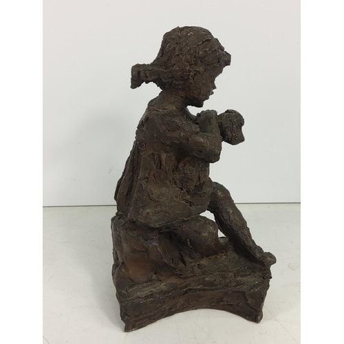 634 - Cold cast figure of a girl and dog, 18cms