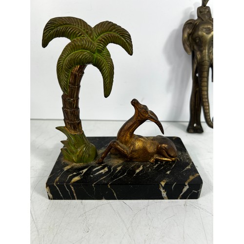 20 - Art deco deer and palmtree on marble base, Elephant door knocker and mounted regimental badge