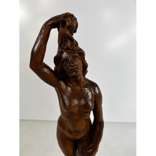 76 - Carved wooden Figure of nude lady on marble base, 37cms in height