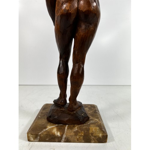 76 - Carved wooden Figure of nude lady on marble base, 37cms in height