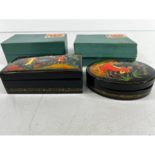 70 - 2 Boxed russian decorated wooden boxes