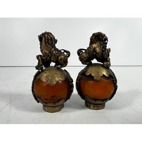 29 - Pair of oriental dog of foe on amber balls